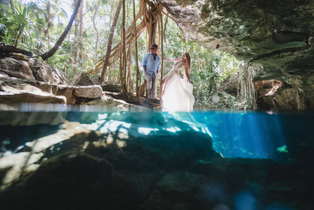 cenote romance with lens half underwater